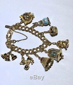 Vintage Signed Monet Loaded Articulating Moving High Quality 8 Charms Bracelet